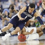 Villanova guard Jalen Brunson (1) and North Carolina forward Kennedy Meeks (3) collide during the second half of the NCAA Final Four tournament college basketball championship game Monday, April 4, 2016, in Houston. (AP Photo/Eric Gay)
