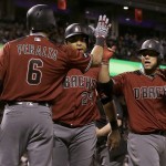 Arizona Diamondbacks' Welington Castillo, right, is congratulated by David Peralta (6) after hitting a two-run home run that scored Yasmany Tomas, center, during the seventh inning of a baseball game against the San Francisco Giants in San Francisco, Wednesday, April 20, 2016. (AP Photo/Jeff Chiu)