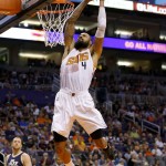 Phoenix Suns center Tyson Chandler (4) dunks against the Utah Jazz during the second half of an NBA basketball game, Sunday, April 3, 2016, in Phoenix. (AP Photo/Matt York)