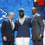 Alabama's A'Shawn Robinson poses for photos with NFL Commissioner Roger Goodell and former NFL player Herman Moore after being selected by Detroit Lions as 46th pick in the second round of the 2016 NFL football draft, Friday, April 29, 2016, in Chicago. (AP Photo/Charles Rex Arbogast)