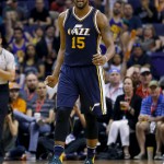 Utah Jazz forward Derrick Favors (15) reacts to a basket during the second half of an NBA basketball game against the Phoenix Suns, Sunday, April 3, 2016, in Phoenix. (AP Photo/Matt York)