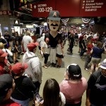 Fans arrive at Chase Field prior to an opening day baseball game between the Colorado Rockies and the Arizona Diamondbacks, Monday, April 4, 2016, in Phoenix. (AP Photo/Matt York)