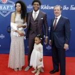 Florida State's Jalen Ramsey, center, poses for photos upon arriving for the first round of the 2016 NFL football draft at the Auditorium Theater of Roosevelt University, Thursday, April 28, 2016, in Chicago. (AP Photo/Nam Y. Huh)