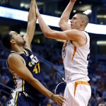 Phoenix Suns center Alex Len (21) shoots over Utah Jazz forward Trey Lyles (41) during the second half of an NBA basketball game, Sunday, April 3, 2016, in Phoenix. (AP Photo/Matt York)