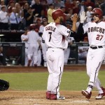 Arizona Diamondbacks' Brandon Drury (27) celebrates his two-run home run against the St. Louis Cardinals with Welington Castillo (7) as Cardinals catcher Yadier Molina, left, watches during the second inning of a baseball game Wednesday, April 27, 2016, in Phoenix. (AP Photo/Ross D. Franklin)