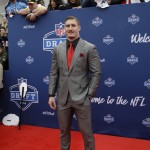 Ohio State's Joey Bosa poses for photos upon arriving for the first round of the 2016 NFL football draft at the Auditorium Theater of Roosevelt University, Thursday, April 28, 2016, in Chicago. (AP Photo/Nam Y. Huh)