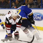 Arizona Coyotes' Jiri Sekac, left, of the Czech Republic, collides with St. Louis Blues' Jaden Schwartz during the first period of an NHL hockey game Monday, April 4, 2016, in St. Louis. (AP Photo/Billy Hurst)
