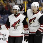 Arizona Coyotes left wing Anthony Duclair (10) and defenseman Zbynek Michalek (4), of the Czech Republic, celebrate after teammate Antoine Vermette scored a goal against the Nashville Predators in the first period of an NHL hockey game Thursday, April 7, 2016, in Nashville, Tenn. (AP Photo/Mark Humphrey)