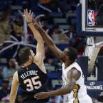 Phoenix Suns forward Mirza Teletovic (35) shoots against New Orleans Pelicans guard Jordan Hamilton (25) in the first half of an NBA basketball game in New Orleans, Saturday, April 9, 2016. (AP Photo/Gerald Herbert)