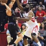 Phoenix Suns guard Devin Booker, left, looks to pass as Houston Rockets guard James Harden defends during the first half of an NBA basketball game Thursday, April 7, 2016, in Houston. (AP Photo/Eric Christian Smith)