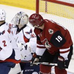 Arizona Coyotes' Shane Doan (19) redirects the puck past Philipp Grubauer (31), of Germany, for a goal as Capitals' Matt Niskanen (2) looks for the puck during the third period of an NHL hockey game Saturday, April 2, 2016, in Glendale, Ariz. The Coyotes defeated the Capitals 3-0. (AP Photo/Ross D. Franklin)