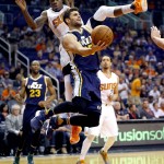 Utah Jazz guard Raul Neto (25), of Brazil, is fouled by Phoenix Suns guard Archie Goodwin (20) during the first half of an NBA basketball game, Sunday, April 3, 2016, in Phoenix. (AP Photo/Matt York)