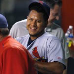St. Louis Cardinals starting pitcher Carlos Martinez smiles in the dugout during the ninth inning of a baseball game against the Arizona Diamondbacks, Tuesday, April 26, 2016, in Phoenix. (AP Photo/Matt York)