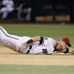 Arizona Diamondbacks' Jake Lamb is unable to reach an RBI single by St. Louis Cardinals' Aledmys Diaz during the seventh inning of a baseball game Wednesday, April 27, 2016, in Phoenix. (AP Photo/Ross D. Franklin)