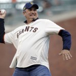 California football coach Sonny Dykes throws out the ceremonial first pitch before a baseball game between the San Francisco Giants and the Arizona Diamondbacks on Tuesday, April 19, 2016, in San Francisco.(AP Photo/Marcio Jose Sanchez)