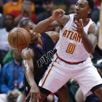 Atlanta Hawks guard Jeff Teague (0) has the ball knocked away by Phoenix Suns guard Ronnie Price during the first half of an NBA game Tuesday, April 5, 2016, in Atlanta. (AP Photo/John Bazemore)