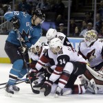 San Jose Sharks' Patrick Marleau (12) works in front of the goal against Arizona Coyotes' Klas Dahlbeck (34) and goalie Mike Smith (41) during the first period of an NHL hockey game Saturday, April 9, 2016, in San Jose, Calif. (AP Photo/Marcio Jose Sanchez)
