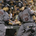Arizona Diamondbacks' Welington Castillo (7) is congratulated by Nick Ahmed after hitting a solo home run against the San Francisco Giants during the fourth inning of a baseball game in San Francisco, Monday, April 18, 2016. (AP Photo/Jeff Chiu)
