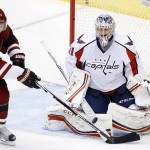 Arizona Coyotes' Shane Doan (19) reaches out to try to redirect the puck in front of Washington Capitals' Philipp Grubauer, of Germany, during the third period of an NHL hockey game Saturday, April 2, 2016, in Glendale, Ariz. The Coyotes defeated the Capitals 3-0. (AP Photo/Ross D. Franklin)