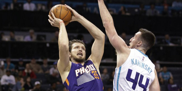 Phoenix Suns' Mirza Teletovic (35) shoots over Charlotte Hornets' Frank Kaminsky III during the fir...
