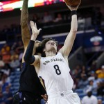 New Orleans Pelicans forward Luke Babbitt (8) goes to the basket against Phoenix Suns center Tyson Chandler (4) in the first half of an NBA basketball game in New Orleans, Saturday, April 9, 2016. (AP Photo/Gerald Herbert)