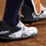Houston Astros' Carlos Gomez wears baseball cleats honoring Jackie Robinson during the first inning of a baseball game against the Detroit Tigers, Friday, April 15, 2016, in Houston. (AP Photo/David J. Phillip)