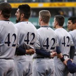 The Milwaukee Brewers line up for the national anthem all wearing the No 42 in honor of Jackie Robinson Day before a baseball game against the Pittsburgh Pirates in Pittsburgh, Friday, April 15, 2016. (AP Photo/Gene J. Puskar)