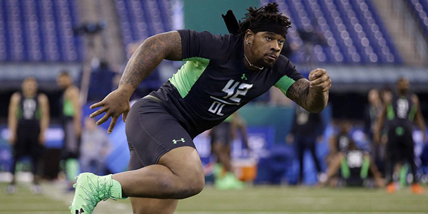 Mississippi defensive lineman Robert Nkemdiche runs a drill at the NFL football scouting combine on...