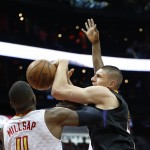 
              CORRECTS SUNS PLAYER TO ALEX LEN, INSTEAD OF TYSON CHANDLER - Phoenix Suns' Alex Len, right, and Atlanta Hawks forward Paul Millsap (4) vie for a rebound during the first half of an NBA game Tuesday, April 5, 2016, in Atlanta. (AP Photo/John Bazemore)
            