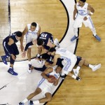 North Carolina's Kennedy Meeks grabs a loose ball as he falls during the second half of the NCAA Final Four tournament college basketball championship game against Villanova, Monday, April 4, 2016, in Houston. (AP Photo/Michael Simmons)