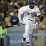 Los Angeles Dodgers' Yasiel Puig watches his RBI single against the Arizona Diamondbacks during seventh inning of a baseball game in Los Angeles, Thursday, April 14, 2016. (AP Photo/Chris Carlson)