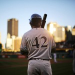 Milwaukee Brewers' Domingo Santana waits on-deck before a baseball game against the Pittsburgh Pirates in Pittsburgh, Friday, April 15, 2016. All players wore the No. 42 in honor of Jackie Robinson Day. (AP Photo/Gene J. Puskar)