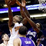 Phoenix Suns forward P.J. Tucker (17) shoots over Sacramento Kings forward Rudy Gay (8) during the second half of an NBA basketball game, Monday, April 11, 2016, in Phoenix. (AP Photo/Matt York)