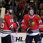 Chicago Blackhawks right wing Richard Panik (14) celebrates his goal against the Arizona Coyotes with Chicago Blackhawks left wing Andrew Ladd (16) in the first period of an NHL hockey game Tuesday, April 5, 2016, in Chicago. (AP Photo/David Banks)