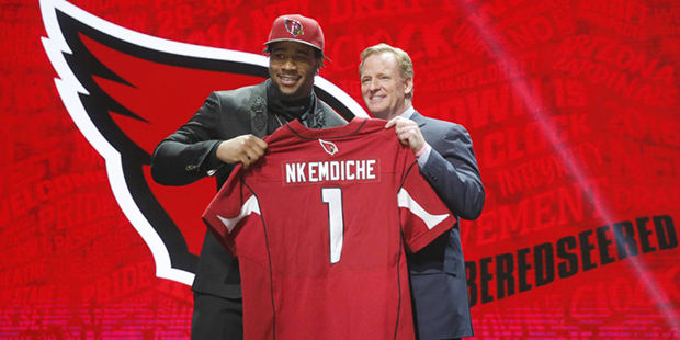 Mississippi's Robert Nkemdiche poses for photos with NFL commissioner Roger Goodell after being sel...
