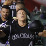 Colorado Rockies' Nick Hundley looks up as he celebrates his three-run home run against the Arizona Diamondbacks during the fourth inning of a baseball game Tuesday, April 5, 2016, in Phoenix. (AP Photo/Ross D. Franklin)