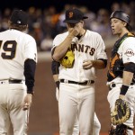 San Francisco Giants starting pitcher Matt Cain, center, gets a visit to the mound from pitching coach Dave Righetti (19) after Cain gave up an RBI triple to Arizona Diamondbacks' Jake Lamb during the fifth inning of a baseball game Tuesday, April 19, 2016, in San Francisco. (AP Photo/Marcio Jose Sanchez)