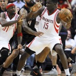 Houston Rockets forward Clint Capela (15) looks to pass to Jason Terry, left, as Phoenix Suns center Tyson Chandler (4) defends during the second half of an NBA basketball game, Thursday, April 7, 2016, in Houston. Phoenix won 124-115. (AP Photo/Eric Christian Smith)