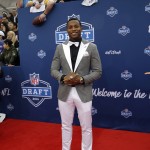 Ohio State's Darron Lee poses for photos upon arriving for the first round of the 2016 NFL football draft at the Auditorium Theater of Roosevelt University, Thursday, April 28, 2016, in Chicago. (AP Photo/Nam Y. Huh)