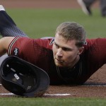 Arizona Diamondbacks' Brandon Drury looks up after being tagged out by San Francisco Giants first baseman Brandon Belt on a pick-off during the first inning of a baseball game in San Francisco, Wednesday, April 20, 2016. (AP Photo/Jeff Chiu)