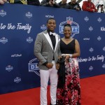 Ohio State's Darron Lee, left, poses for photos upon arriving for the first round of the 2016 NFL football draft at the Auditorium Theater of Roosevelt University, Thursday, April 28, 2016, in Chicago. (AP Photo/Nam Y. Huh)