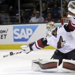 Arizona Coyotes goalie Mike Smith stops a shot against the San Jose Sharks during the first period of an NHL hockey game Saturday, April 9, 2016, in San Jose, Calif. (AP Photo/Marcio Jose Sanchez)