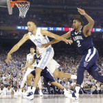 North Carolina forward Brice Johnson (11) chases a loose ball with Villanova forward Kris Jenkins (2) during the second half of the NCAA Final Four tournament college basketball championship game Monday, April 4, 2016, in Houston. (AP Photo/David J. Phillip)