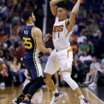 Phoenix Suns guard Devin Booker (1) looks to pass under pressure from Utah Jazz guard Raul Neto (25) during the second half of an NBA basketball game, Sunday, April 3, 2016, in Phoenix. (AP Photo/Matt York)