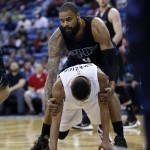 Phoenix Suns center Tyson Chandler (4) helps up New Orleans Pelicans guard Tim Frazier (2) after Frazier was fouled in the first half of an NBA basketball game in New Orleans, Saturday, April 9, 2016. (AP Photo/Gerald Herbert)