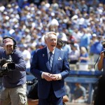 Los Angeles Dodgers broadcaster Vin Scully, is honored before the start of an opening day baseball game between the Los Angeles Dodgers and Arizona Diamondbacks in Los Angeles, Tuesday, April 12, 2016. (AP Photo/Alex Gallardo)