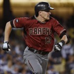 Arizona Diamondbacks' Nick Ahmed runs to first base after he hit a solo home run off of Los Angeles Dodgers starting pitcher Alex Wood during the third inning of a baseball game in Los Angeles, Wednesday, April 13, 2016. (AP Photo/Kelvin Kuo)