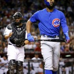 Chicago Cubs Jason Heyward walks to the dugout after striking out as Arizona Diamondbacks catcher Welington Castillo waits for the ball during the first inning of a baseball game, Friday, April 8, 2016, in Phoenix. (AP Photo/Matt York)