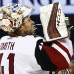 Arizona Coyotes goalie Mike Smith cools down in a break in play during the second period of an NHL hockey game against the St. Louis Blues, Monday, April 4, 2016, in St. Louis. (AP Photo/Billy Hurst)