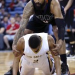 Phoenix Suns center Tyson Chandler (4) helps up New Orleans Pelicans guard Tim Frazier (2) after Frazier was fouled in the first half of an NBA basketball game in New Orleans, Saturday, April 9, 2016. (AP Photo/Gerald Herbert)